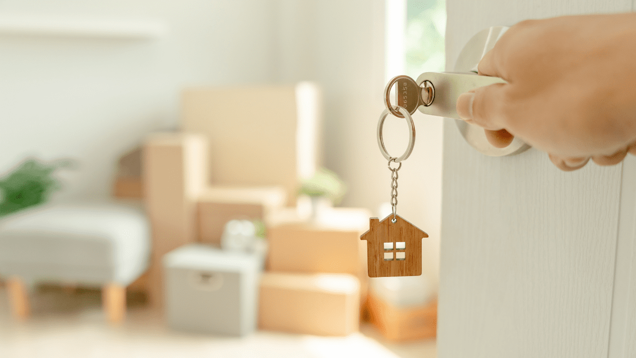 buyer opens door after learning how to buy a house with section 8 voucher
