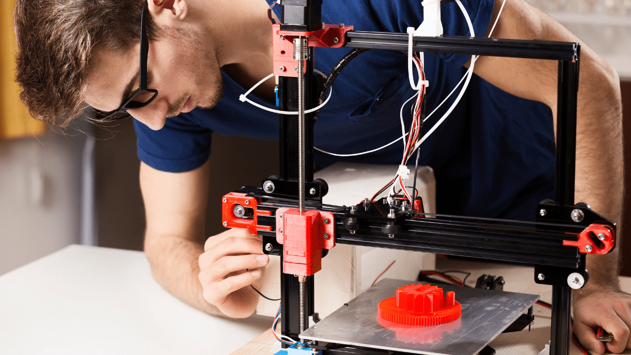 man uses 3d printer at san bernadino library animaker space