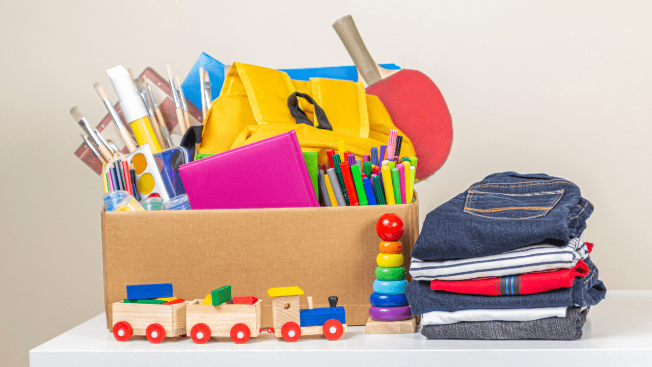free school clothes vouchers and supplies result in a pile of new clothes and a box full of educational tools in Gallipolis, OH