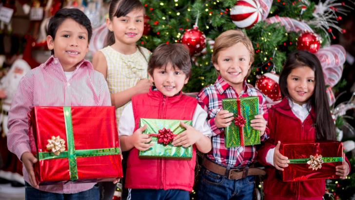 grateful children hold gifts from agencies that offer free Christmas help in New Mexico