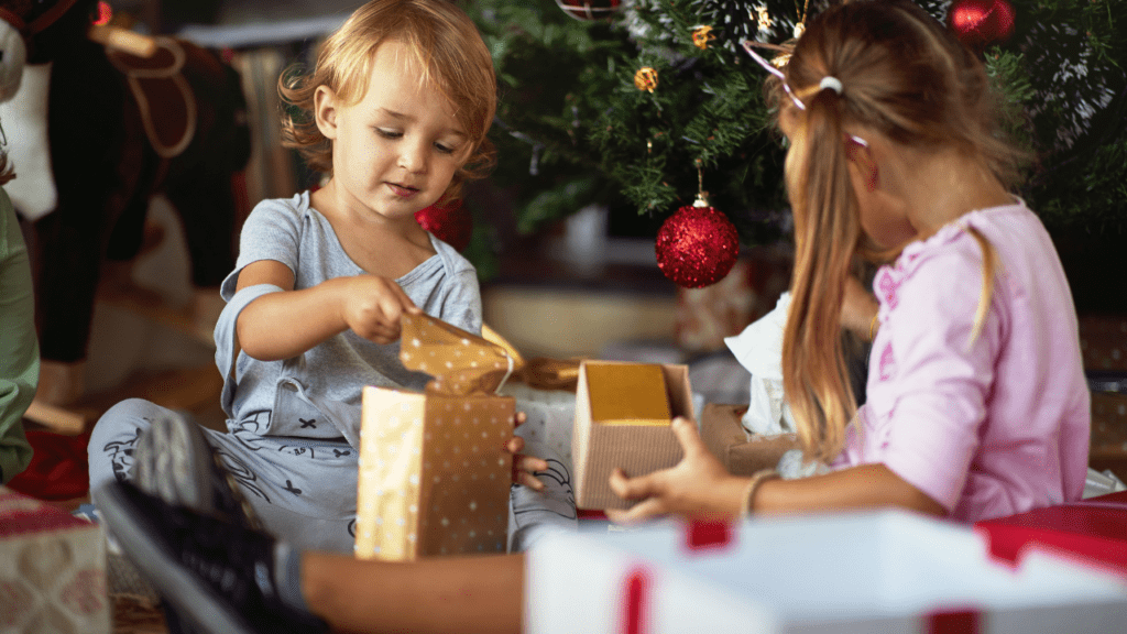 child opens free Christmas gifts in Minnesota