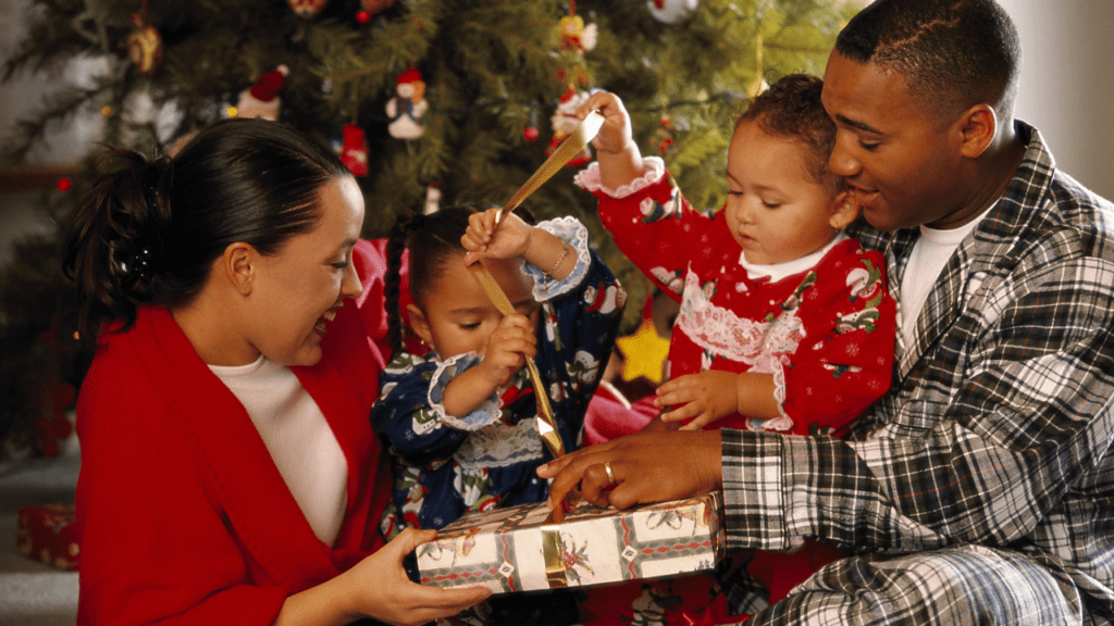 family enjoys a Christmas tree and free Christmas gifts from agencies that offer Christmas help in SC