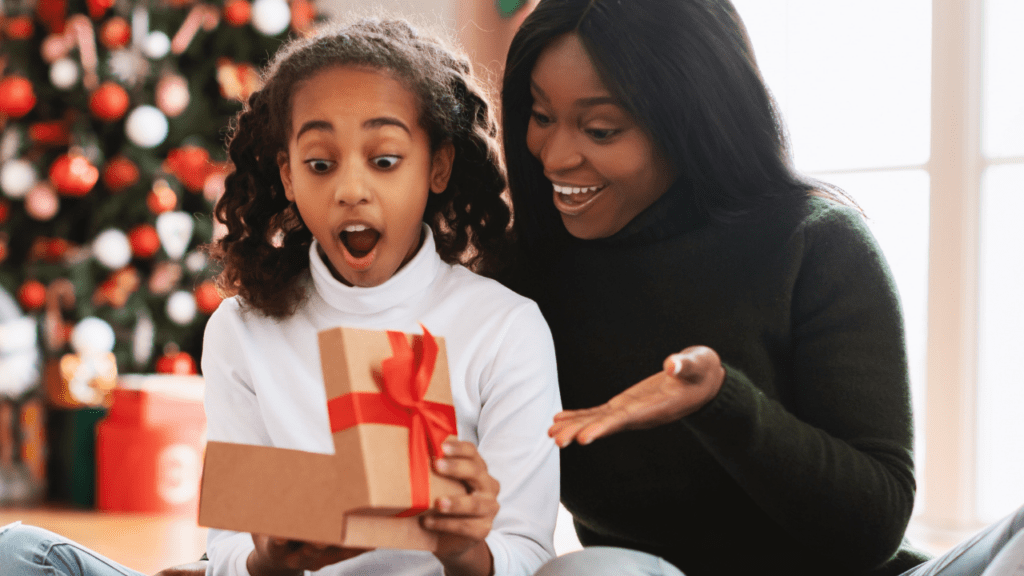 child receives free Christmas gifts from holiday assistance programs in California