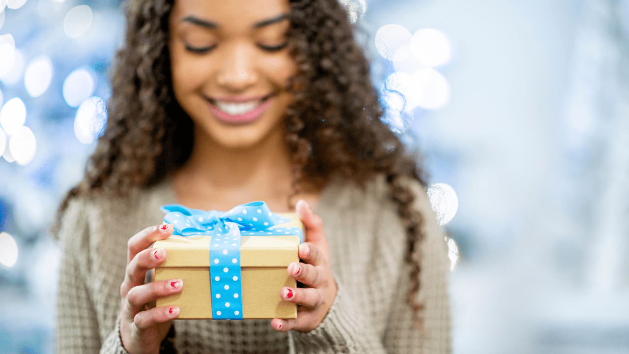 girl opens free Christmas gifts in Oklahoma