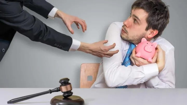man defends himself against things debt collectors cannot do