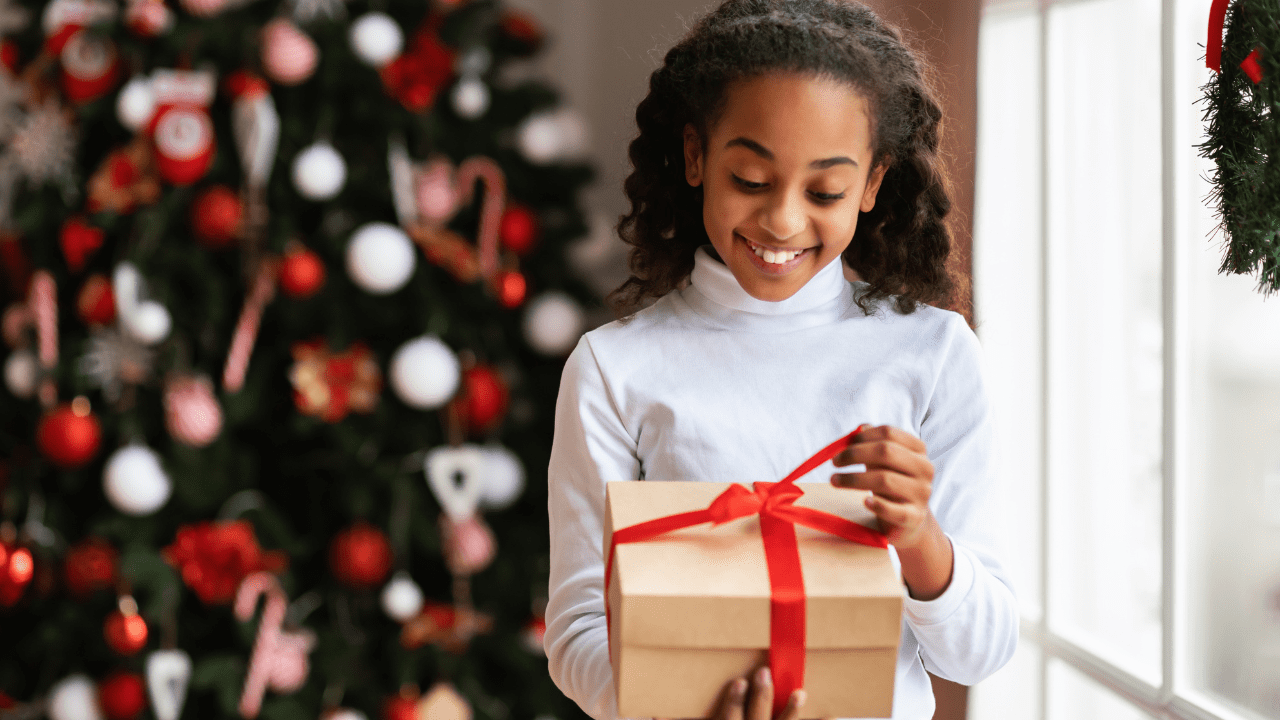 girl receives free Christmas gifts from toy giveaway near Los Angeles