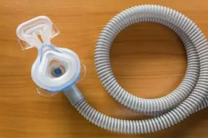 cheap CPAP equipment on a wood table