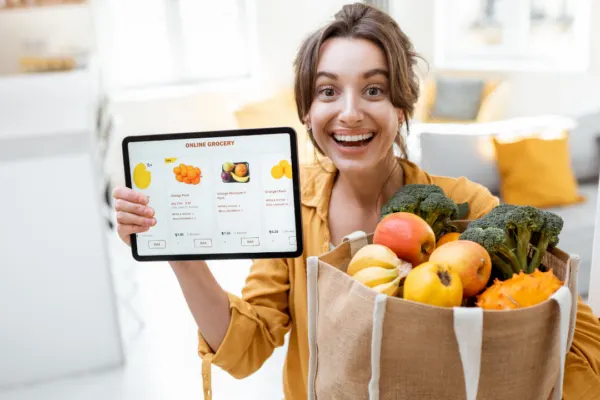 woman gets the answer to can I buy groceries online with EBT and is happy to shop now