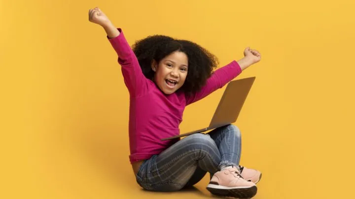 girl is happy because she received a free computer for low income families