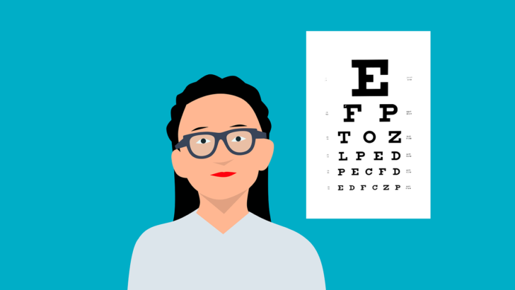 optometrist stands by eye chart offering free eye exams