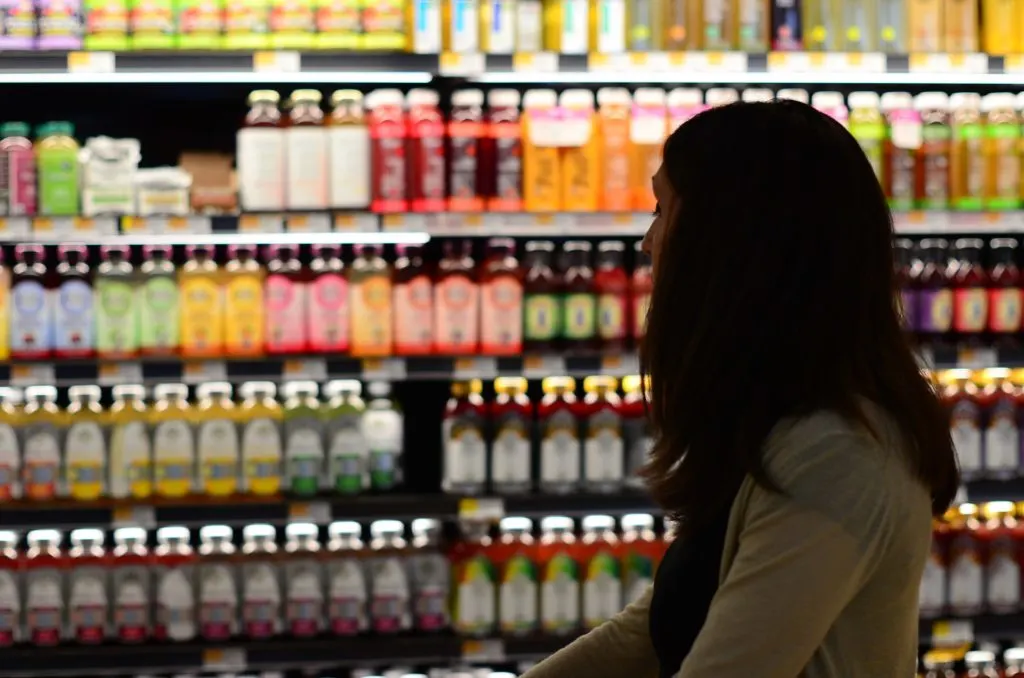 woman in a grocery store in article about tanf
