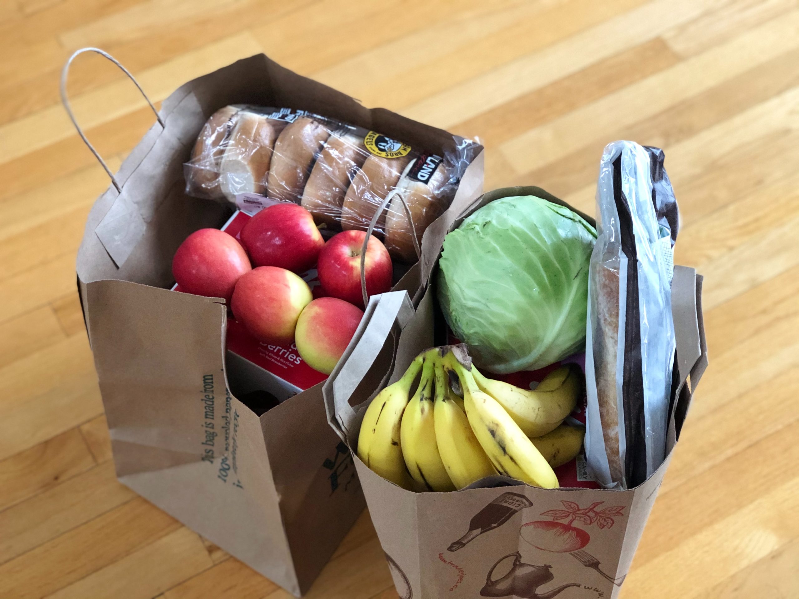 image of grocery bags filled with produce on a countertop in article about where can I order food online with EBT?
