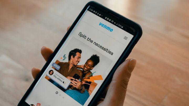 By Unsplash user Tech Daily. An iPhone with the Venmo app open is held to the camera.