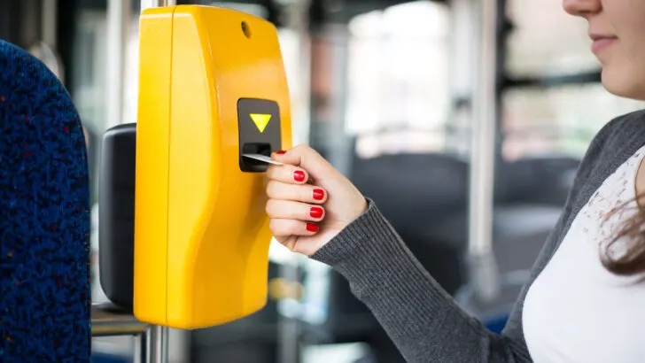 womans wipes a free bus pass into the terminal