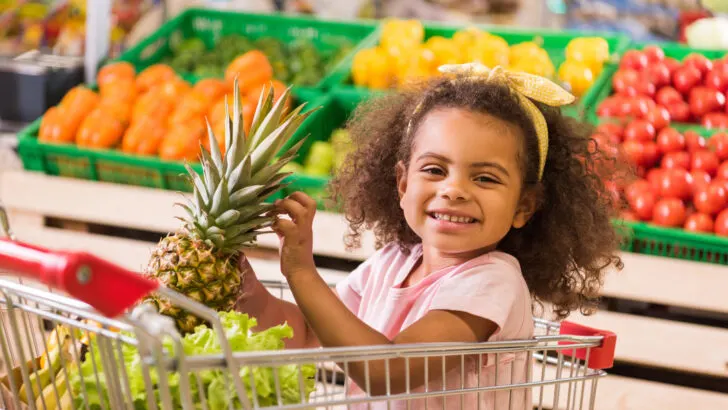 girl shopping for produce is grateful to double your CalFresh at the store