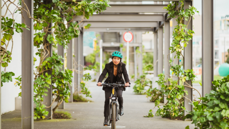 woman rides bike with Lime Access through a city