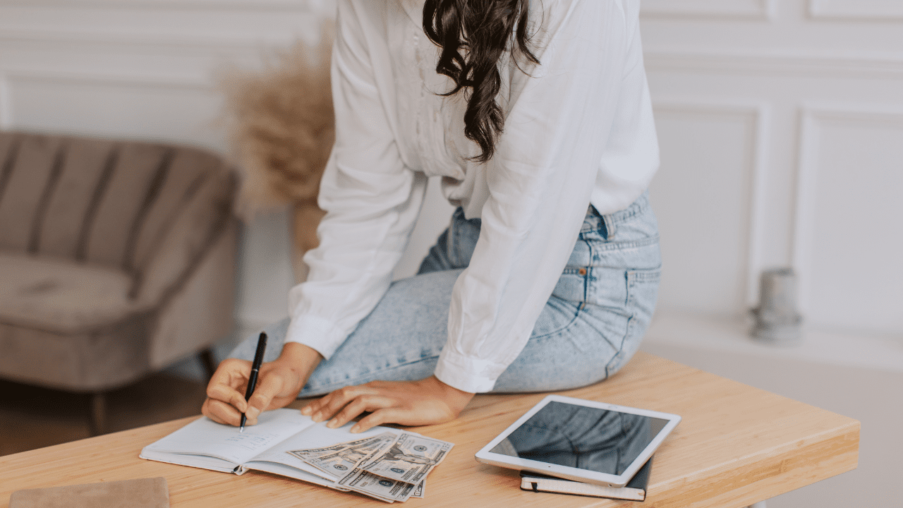 woman works on budget using quicken simplifi