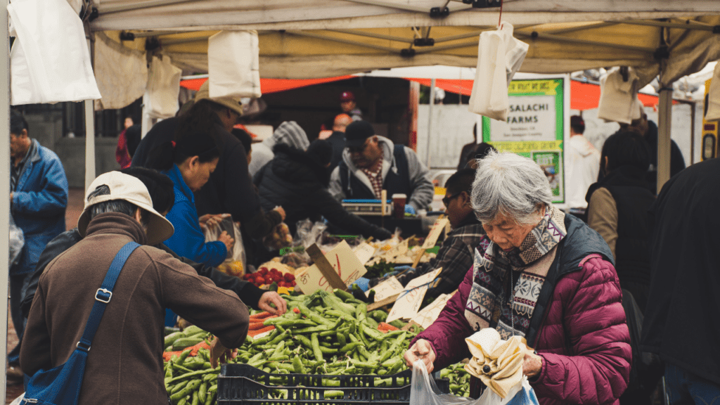 senior gets free food from the farmers market through SFMNP and other programs