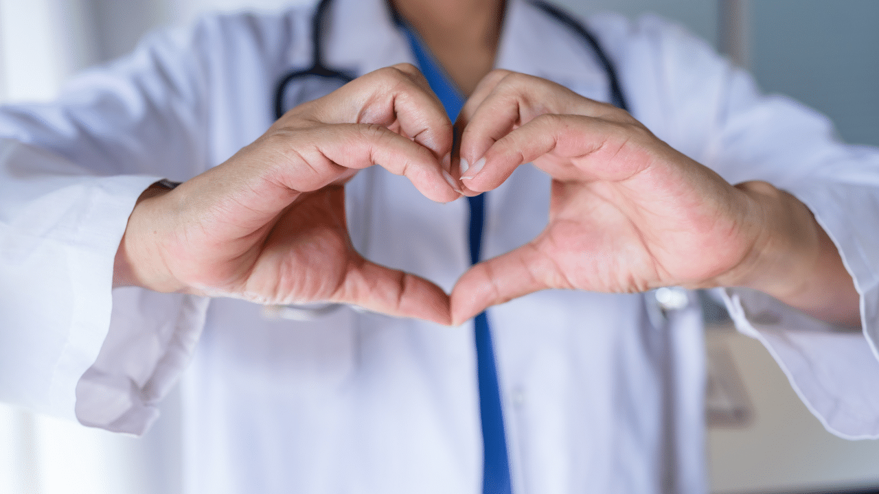 doctor holds heart shape with hands while discussing medicare Q&A results form Ari Parker at Chapter Medicare