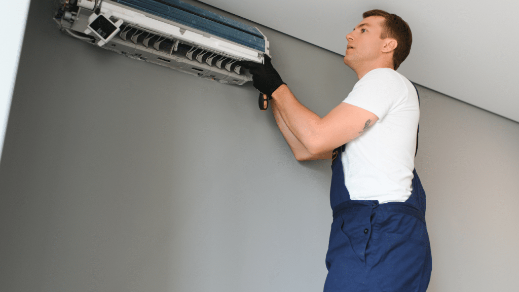 technician provides free home energy assessment to an air conditioner unit in la crosse wisconsin through green homeowners united